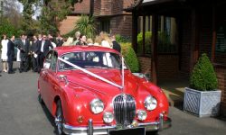1964 Red MK II Jaguar with chrome wire-wheels 3